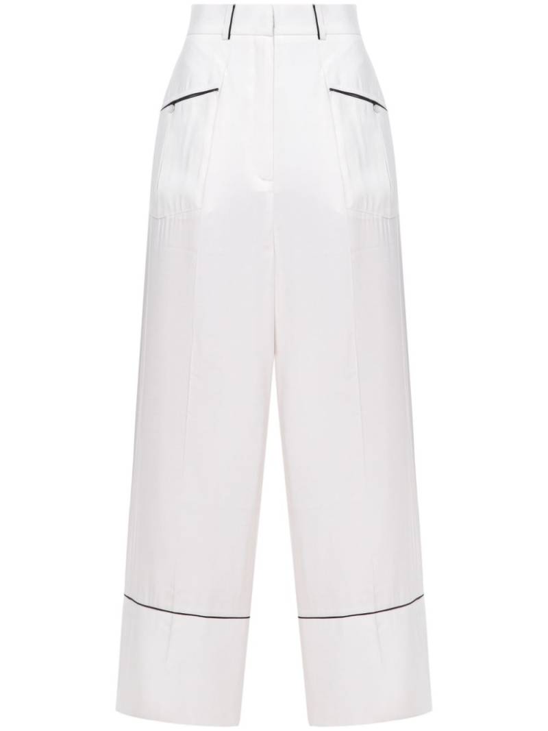 A.M.G. piped-trim trousers - White von A.M.G.