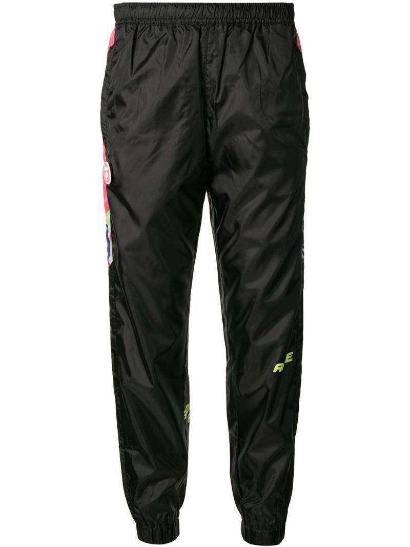 AAPE BY *A BATHING APE® graphic-print track pants - Black von AAPE BY *A BATHING APE®