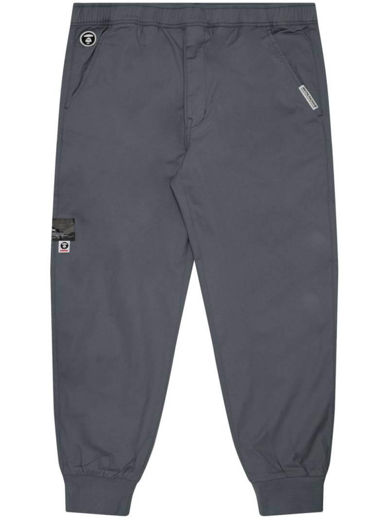 AAPE BY *A BATHING APE® logo-appliqué cotton track pants - Grey von AAPE BY *A BATHING APE®