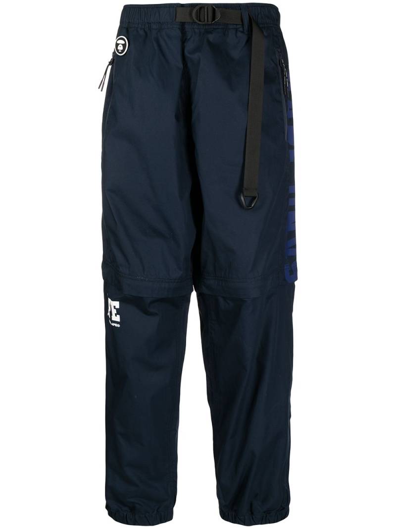 AAPE BY *A BATHING APE® logo-patch zip-up trousers - Blue von AAPE BY *A BATHING APE®