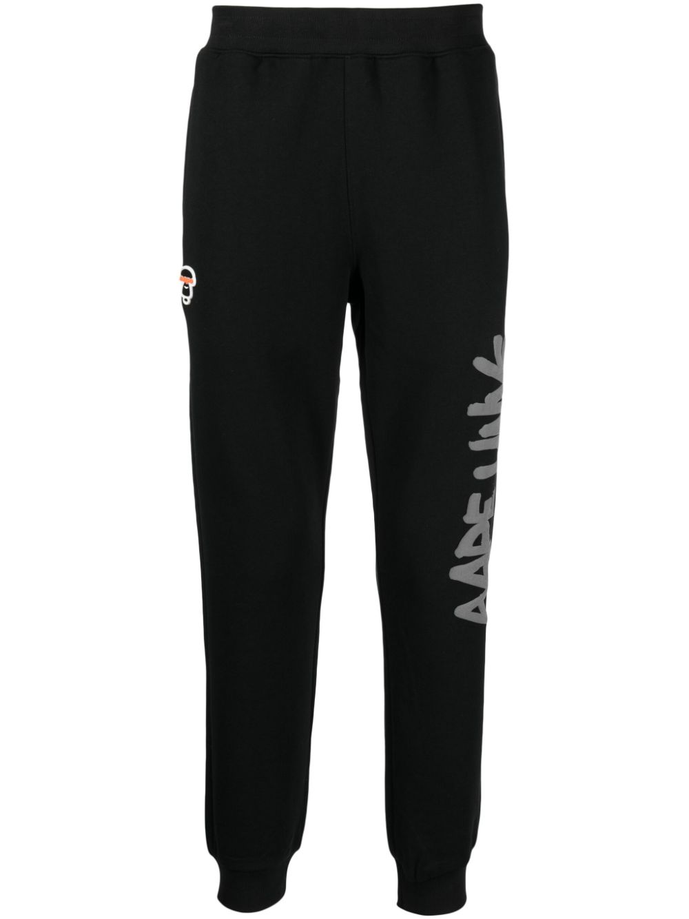 AAPE BY *A BATHING APE® logo-print tapered track pants - Black von AAPE BY *A BATHING APE®