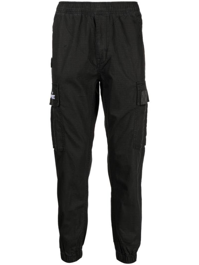 AAPE BY *A BATHING APE® tapered-leg cargo trousers - Black von AAPE BY *A BATHING APE®