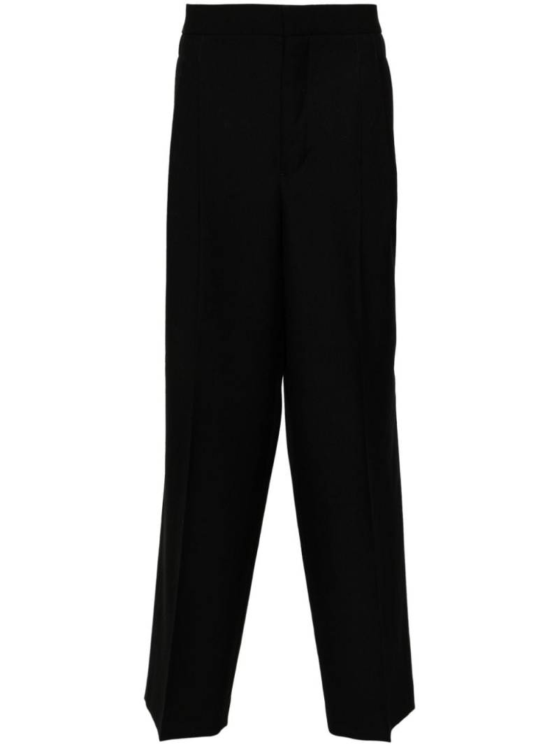 AMI Paris pleat-detail trousers - Black von AMI Paris