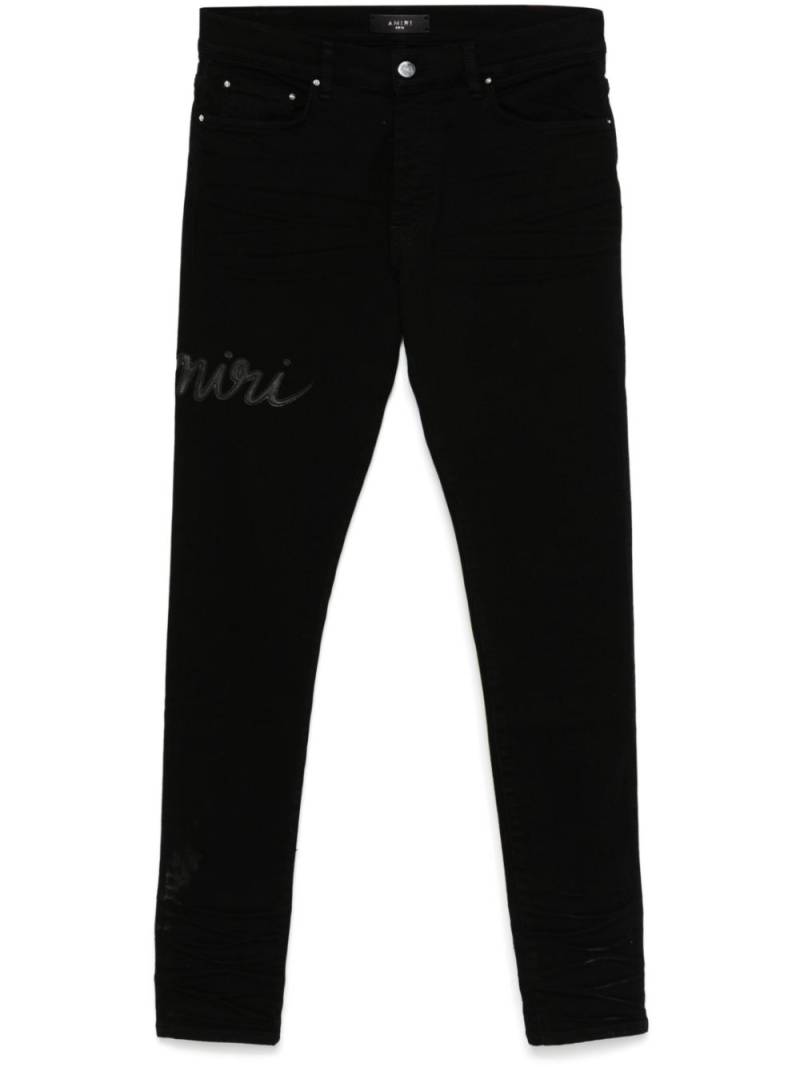 AMIRI Script-logo skinny jeans - Black von AMIRI