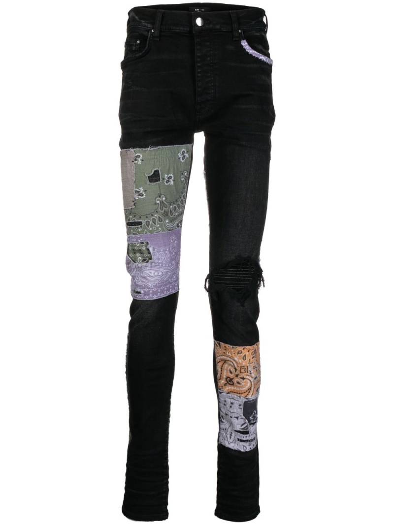 AMIRI distressed patchwork skinny jeans - Black von AMIRI