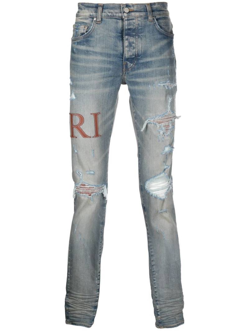 AMIRI leather-stitch logo skinny jeans - Blue von AMIRI