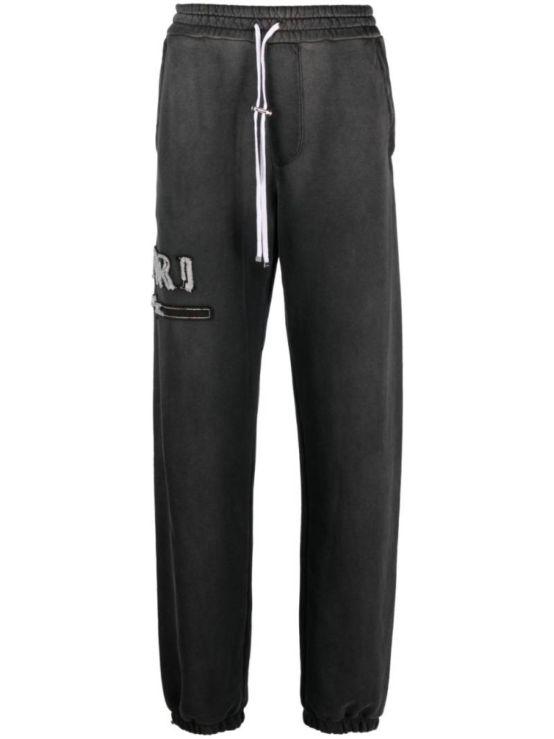 AMIRI logo-appliqué cotton track pants - Black von AMIRI