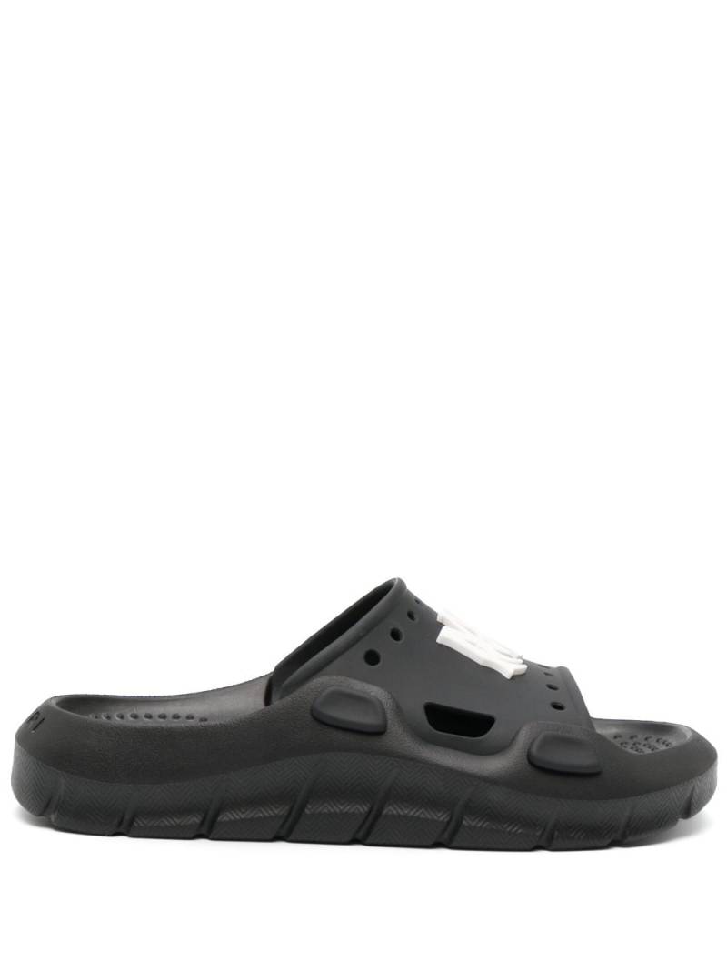 AMIRI logo-patch round-toe slides - Black von AMIRI