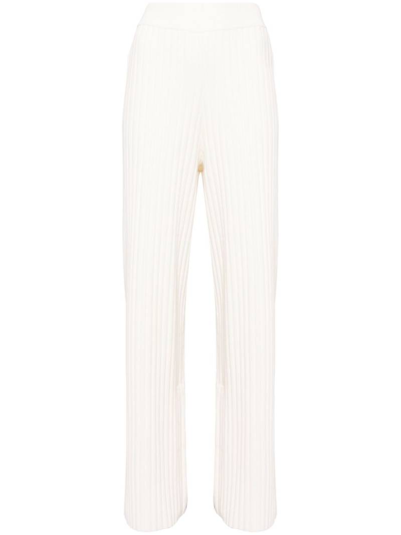 Aje logo-tape ribbed-knit trousers - White von Aje