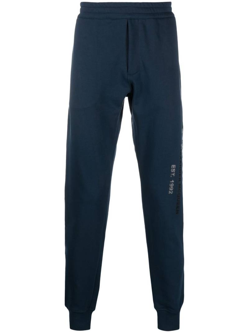 Alexander McQueen Graffiti logo-print track pants - Blue von Alexander McQueen