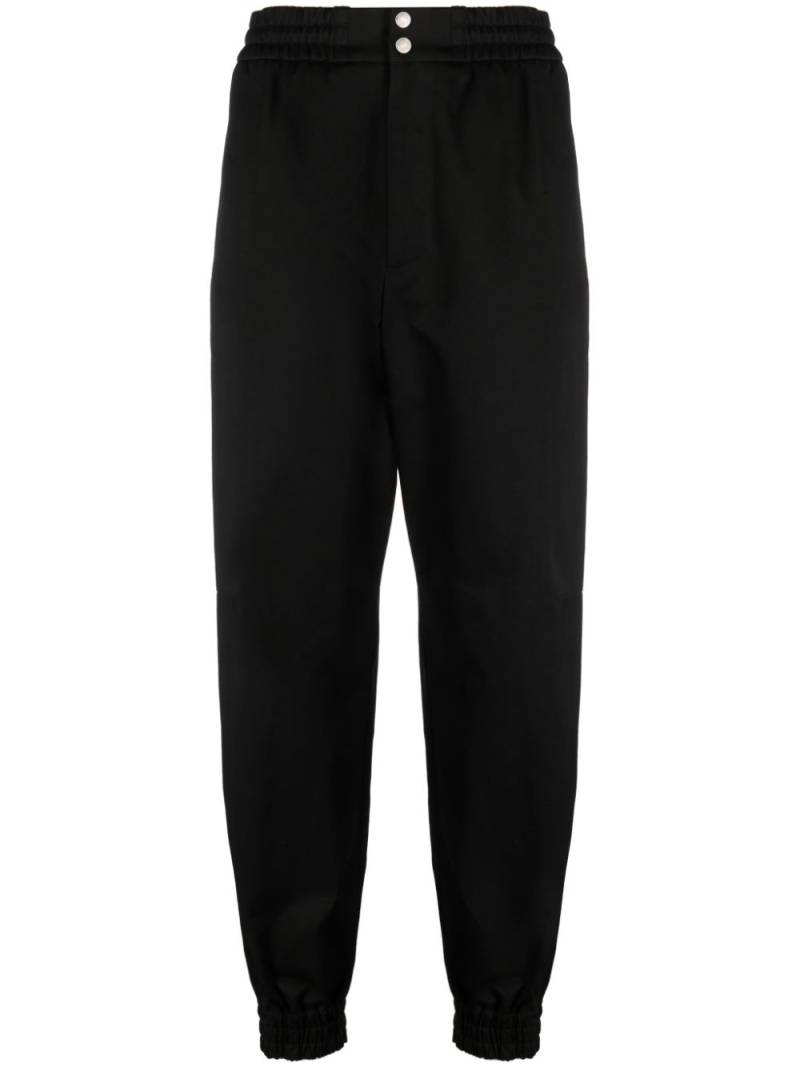 Alexander McQueen tapered-leg cotton trousers - Black von Alexander McQueen