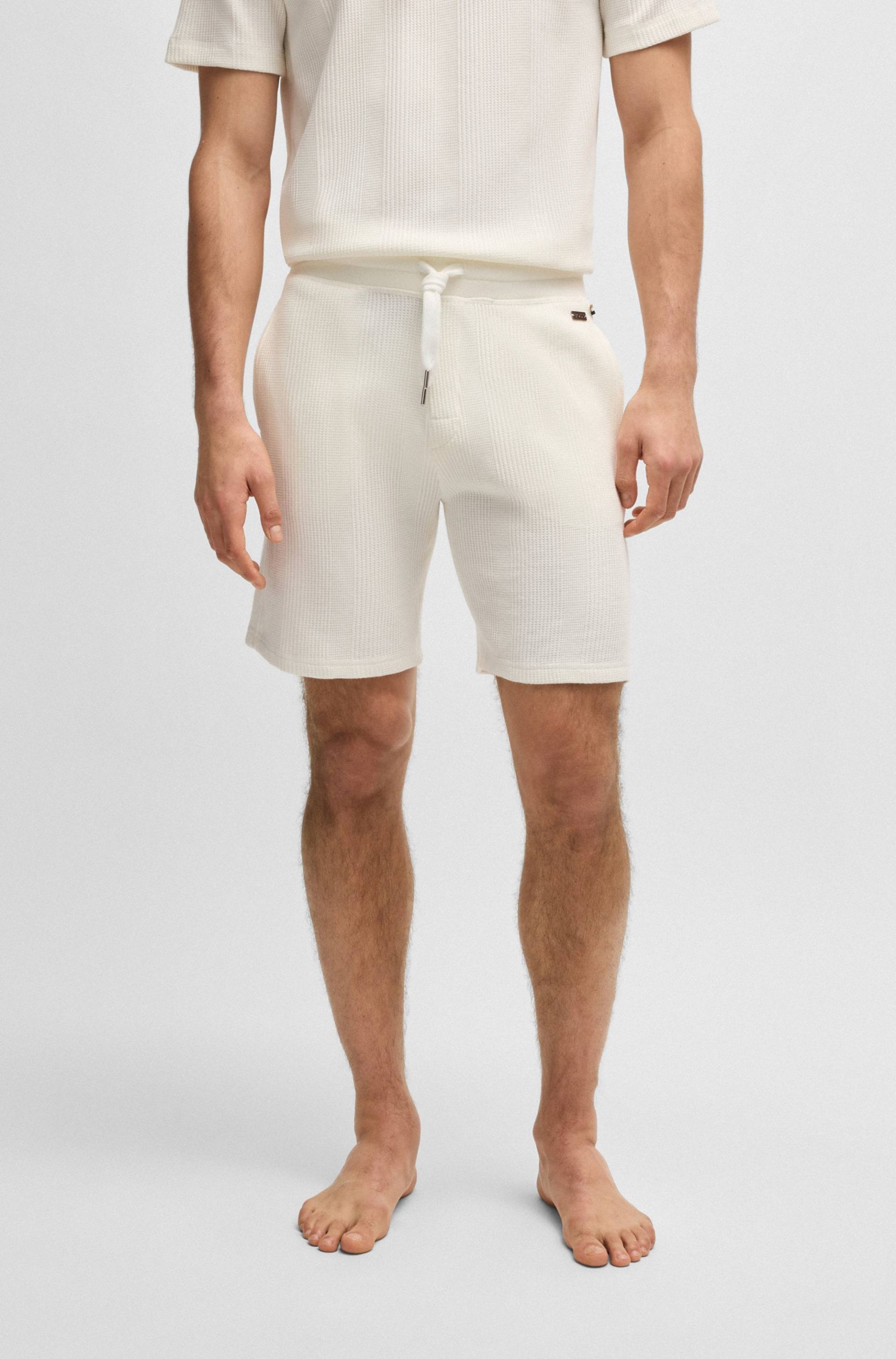 BOSS Sweatshorts »Sweatshorts Structure Sho«, kurze Hose mit Strickeinsätzen BOSS Sweatshorts »Sweatshorts Structure Sho«, kurze Hose mit Strickeinsätzen von BOSS