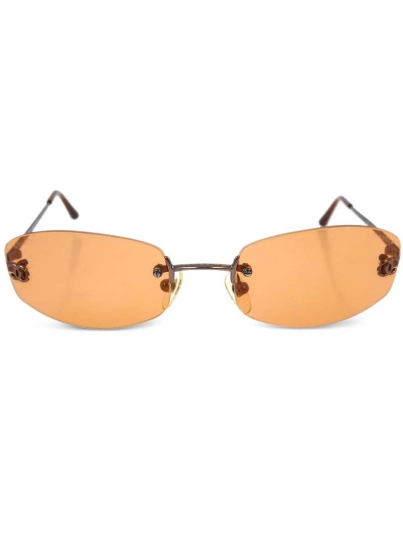 CHANEL Pre-Owned 1990-2000s oval-frame sunglasses - Orange von CHANEL Pre-Owned