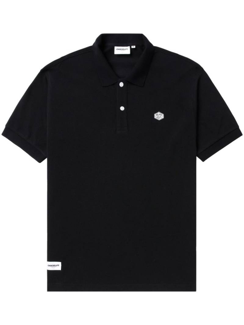 CHOCOOLATE logo-appliqué cotton polo shirt - Black von CHOCOOLATE