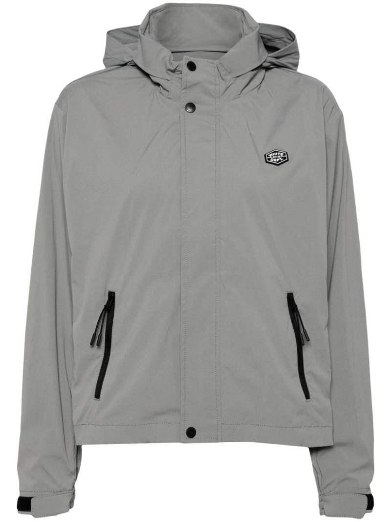 CHOCOOLATE logo-appliqué hooded windbreaker - Grey von CHOCOOLATE