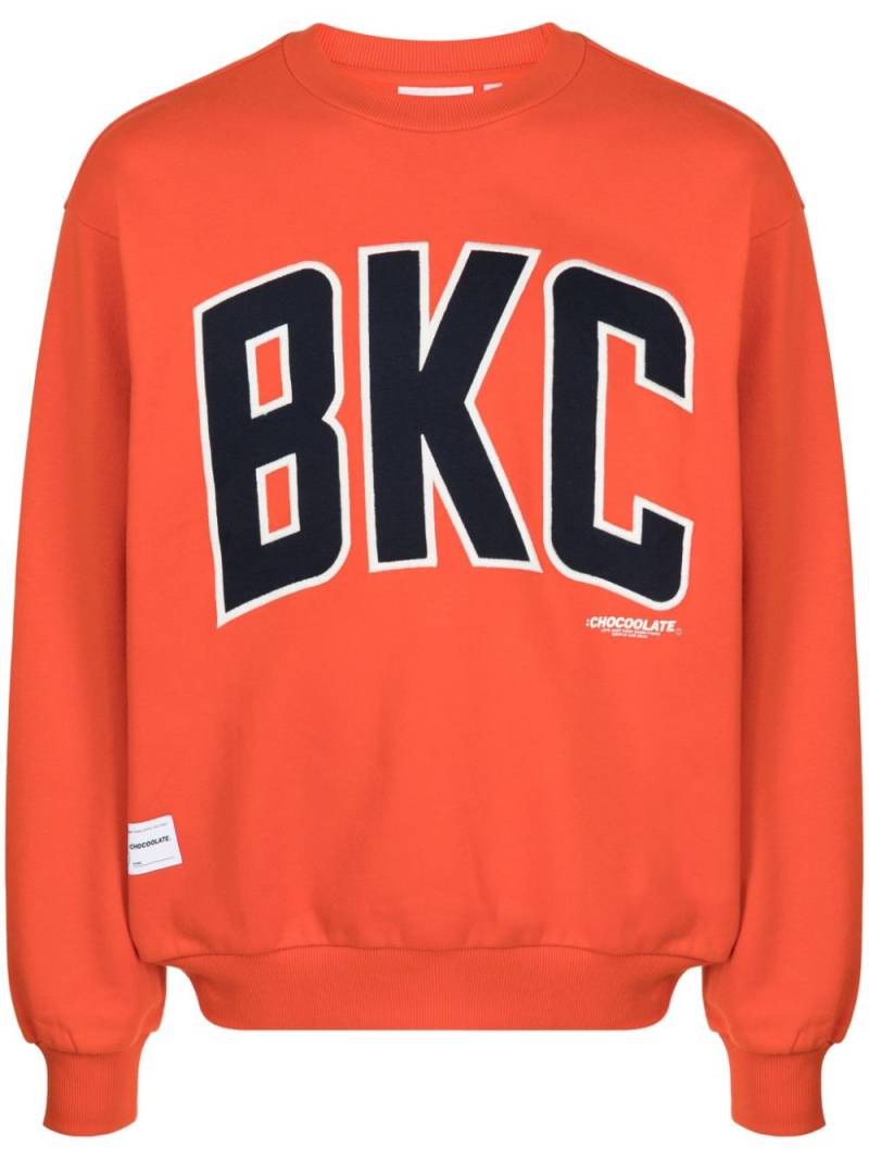 CHOCOOLATE logo-print cotton sweatshirt - Orange von CHOCOOLATE