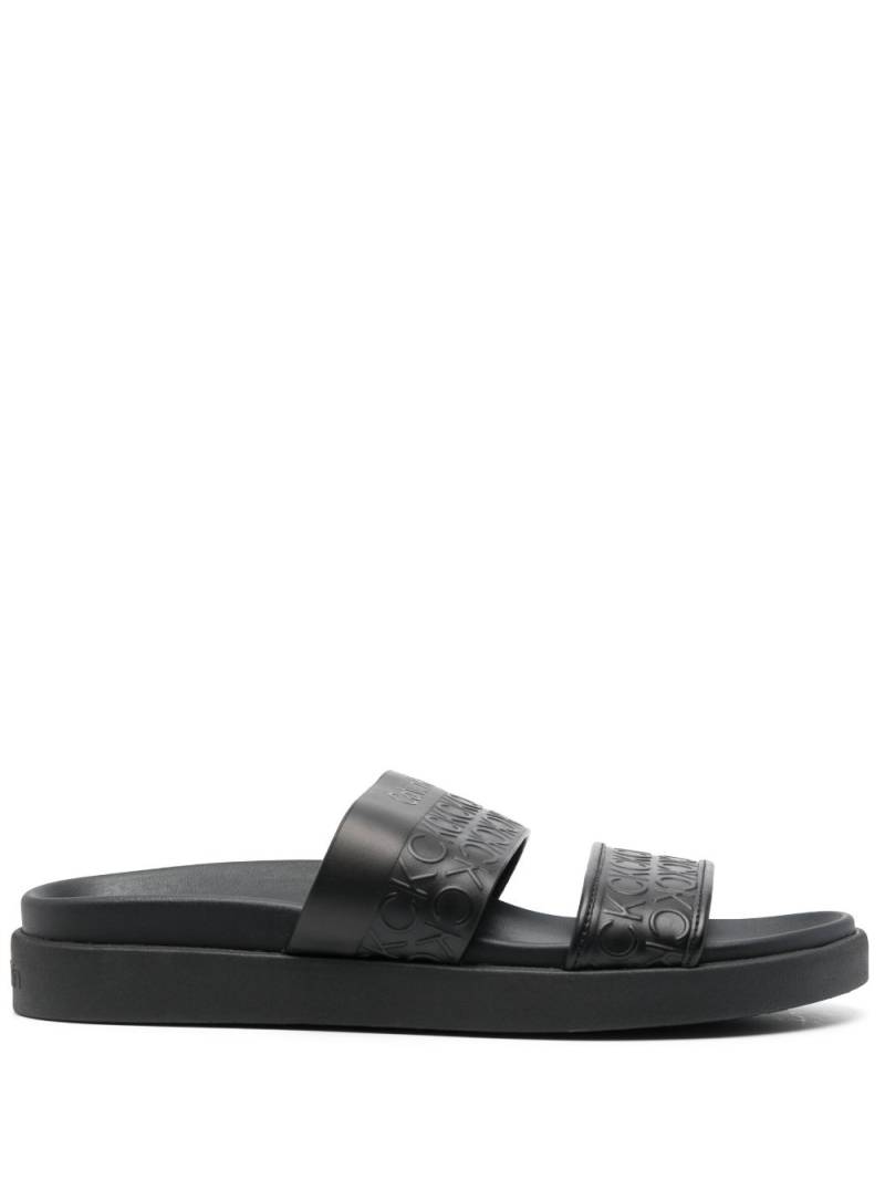 Calvin Klein embossed-logo leather slides - Black von Calvin Klein