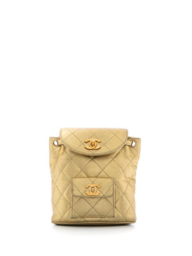 CHANEL Pre-Owned 1991-1994 metallic flap drawstring backpack - Gold von CHANEL Pre-Owned