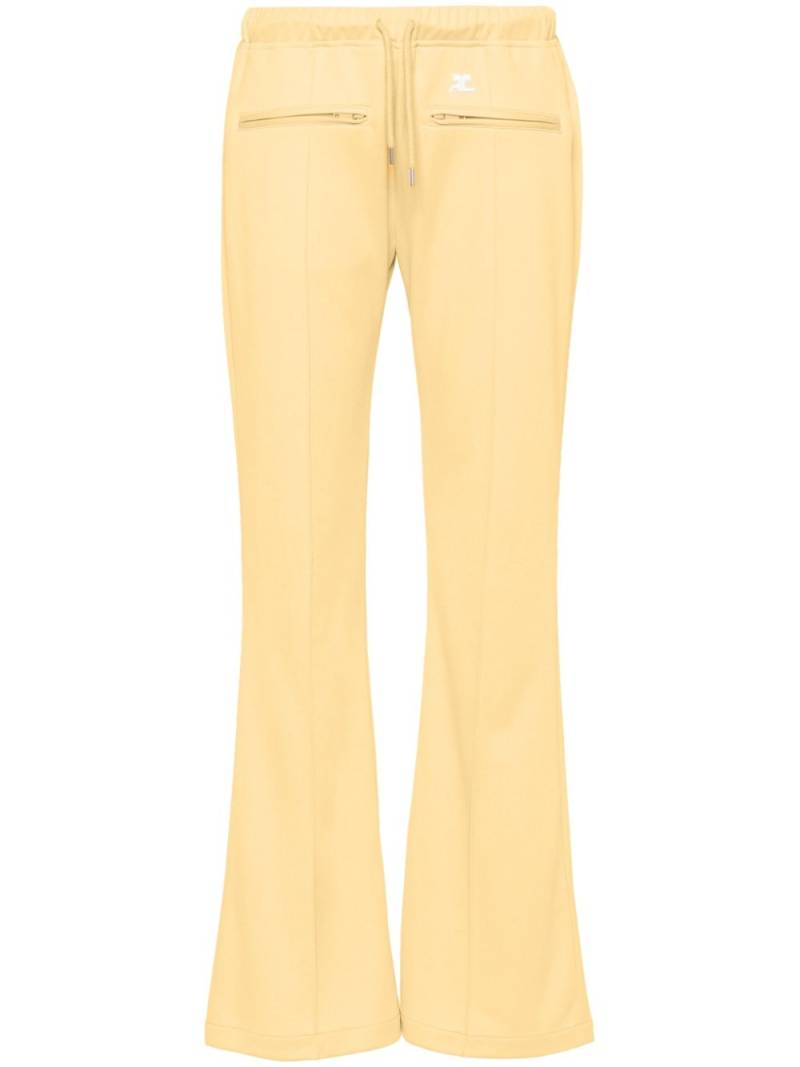 Courrèges logo-appliqué wide trousers - Yellow von Courrèges