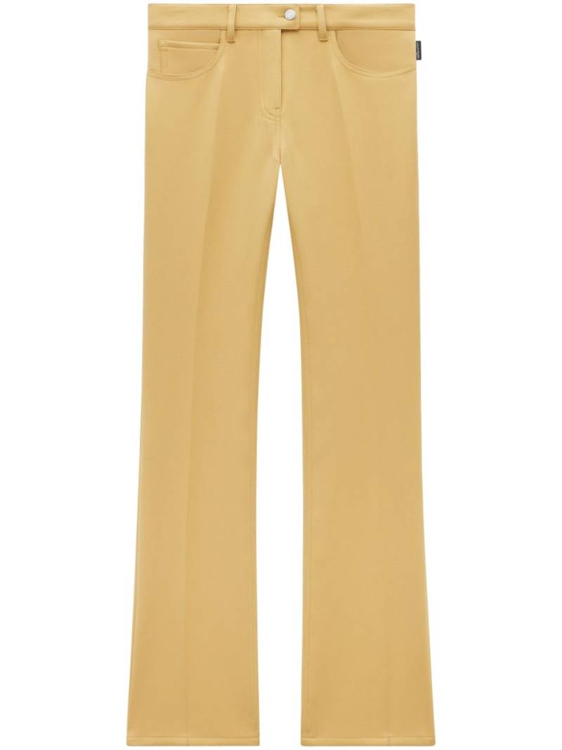 Courrèges low-rise bootcut trousers - Yellow von Courrèges