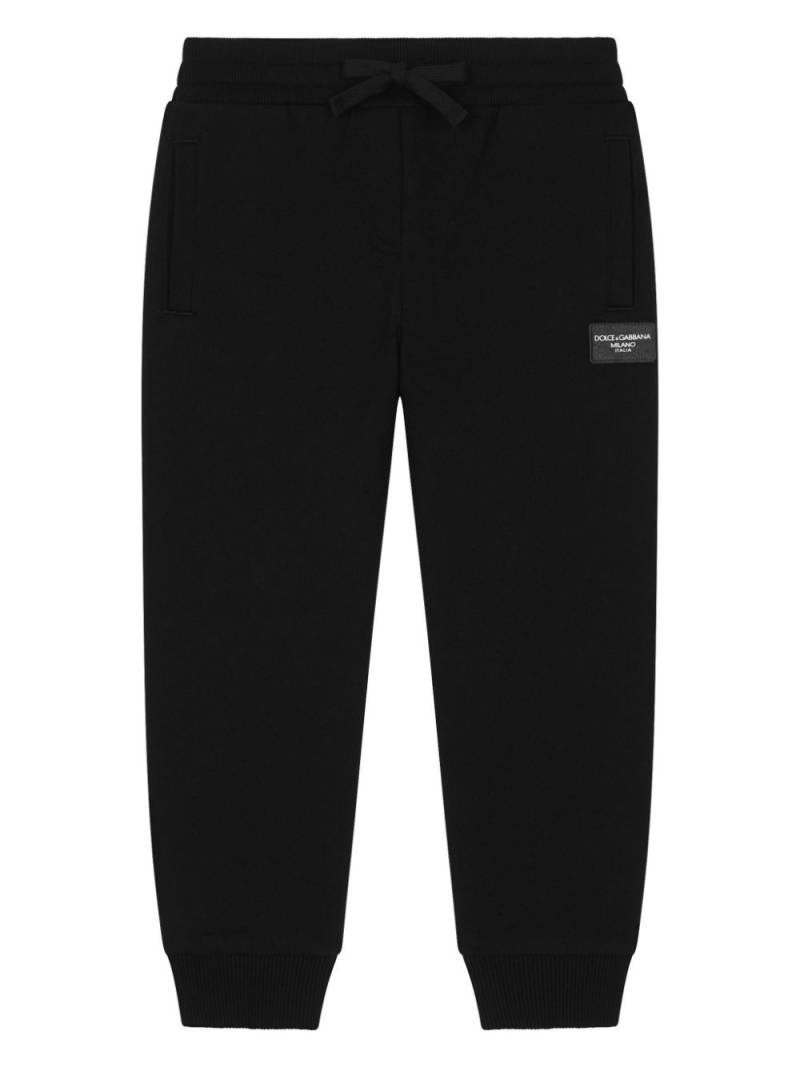 Dolce & Gabbana Kids logo-rubberised jersey track pants - Black von Dolce & Gabbana Kids