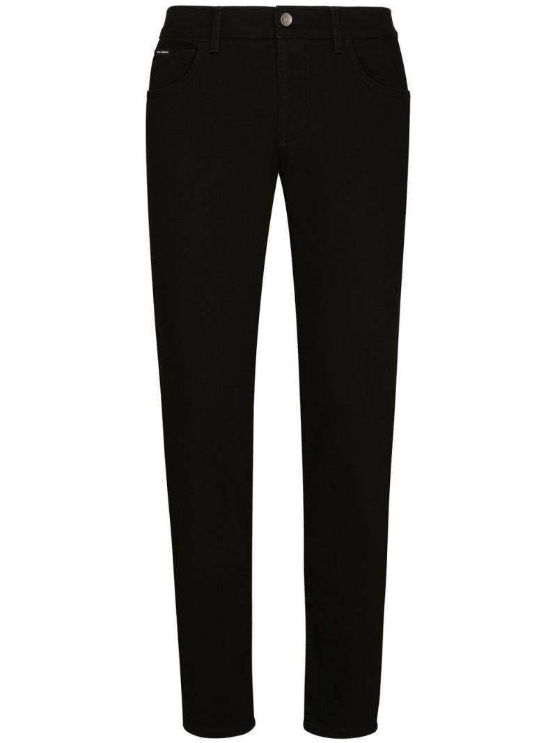 Dolce & Gabbana logo-appliqué slim-cut jeans - Black von Dolce & Gabbana