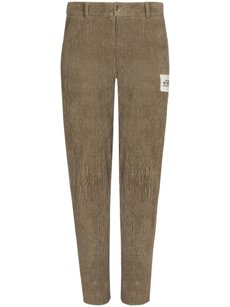 Dolce & Gabbana logo-patch corduroy tapered trousers - Neutrals von Dolce & Gabbana