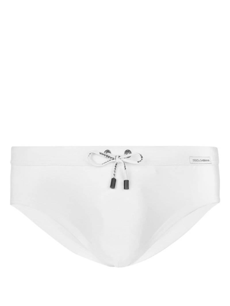 Dolce & Gabbana logo-patch swim trunks - White von Dolce & Gabbana