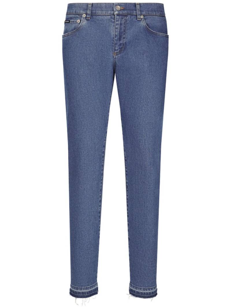 Dolce & Gabbana slim-cut logo-patch jeans - Blue von Dolce & Gabbana