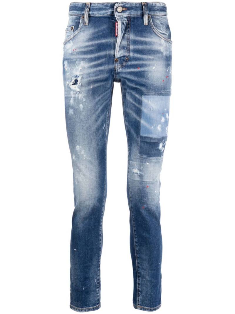 DSQUARED2 paint-splatter distressed skinny jeans - Blue von DSQUARED2