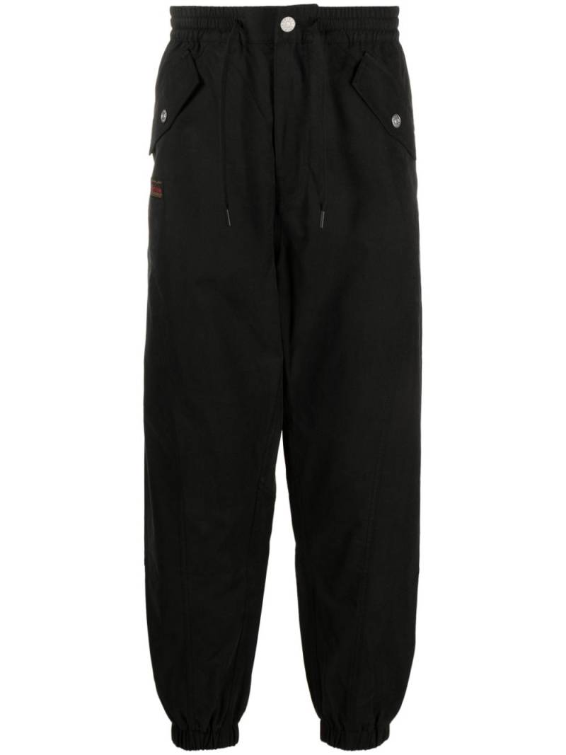 EVISU Daikokuten logo-embroidered tapered trousers - Black von EVISU