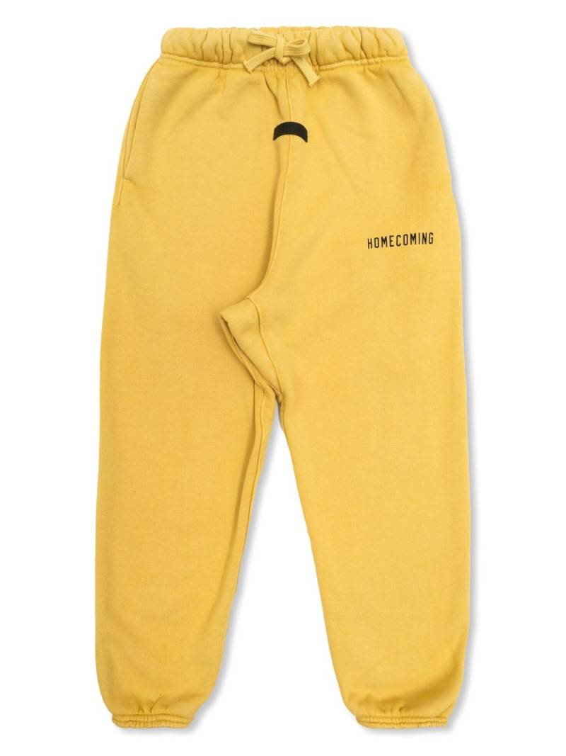 FEAR OF GOD ESSENTIALS KIDS slogan-print track pants - Yellow von FEAR OF GOD ESSENTIALS KIDS