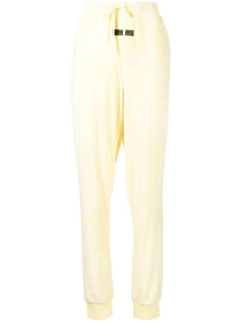 FEAR OF GOD ESSENTIALS logo-patch detail track pants - Yellow von FEAR OF GOD ESSENTIALS