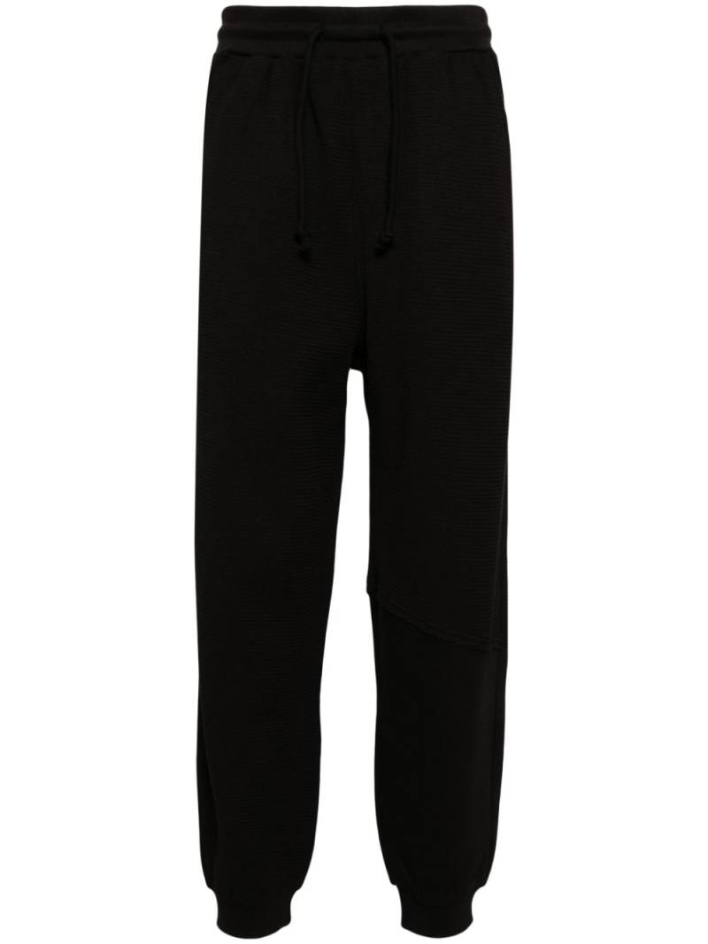 FIVE CM logo-patch cotton track pants - Black von FIVE CM