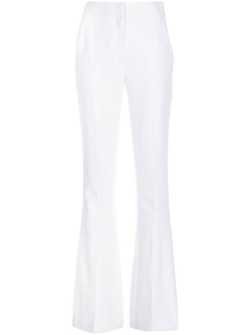 Genny Iconic high-waist flared trousers - White von Genny