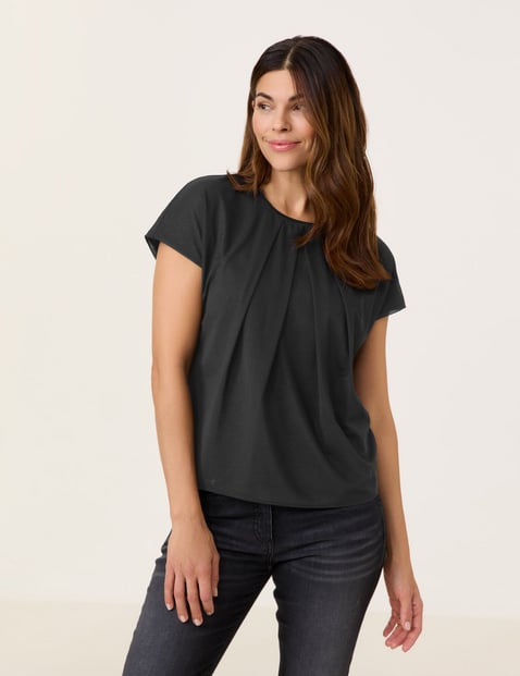 GERRY WEBER Damen Blusenshirt mit schimmerndem Overlayer 62cm Kurzarm Rundhals Schwarz von Gerry Weber