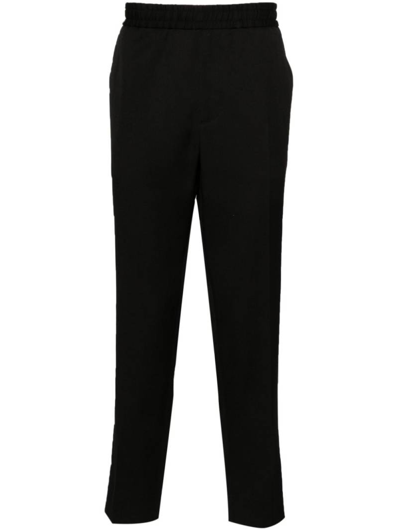 Golden Goose logo-plaque virgin wool trousers - Black von Golden Goose