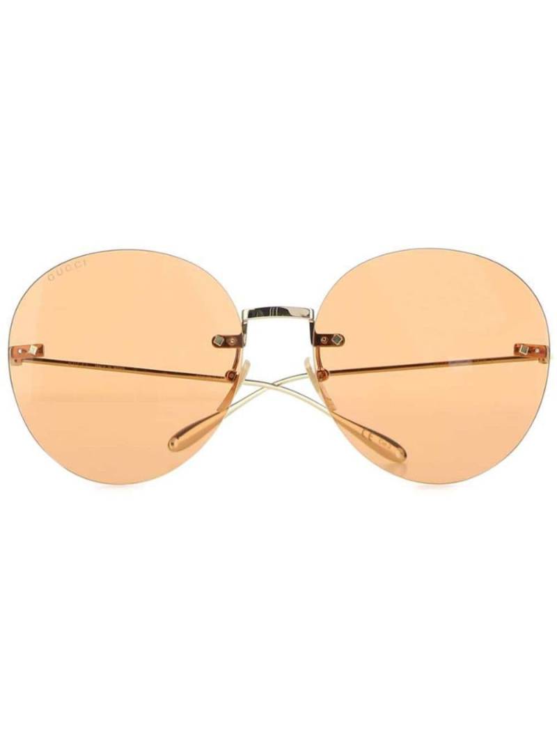 Gucci Eyewear round-frame logo-charm sunglasses - Gold von Gucci Eyewear