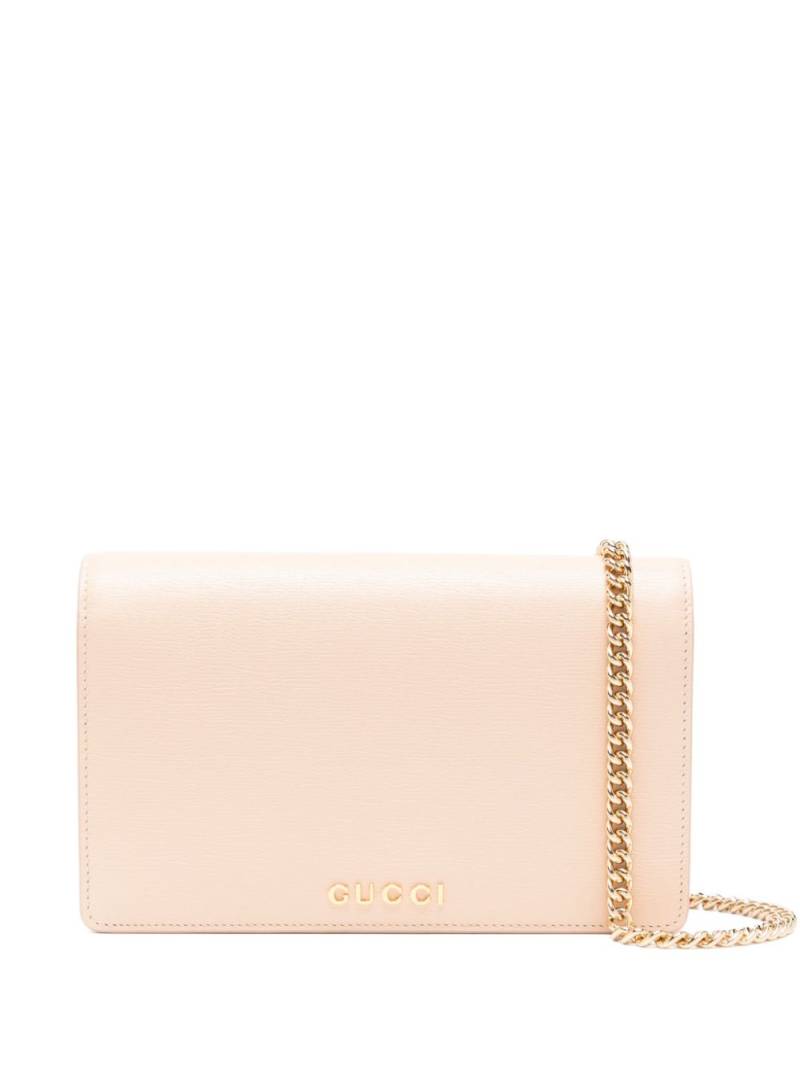 Gucci logo-lettering clutch bag - Pink von Gucci