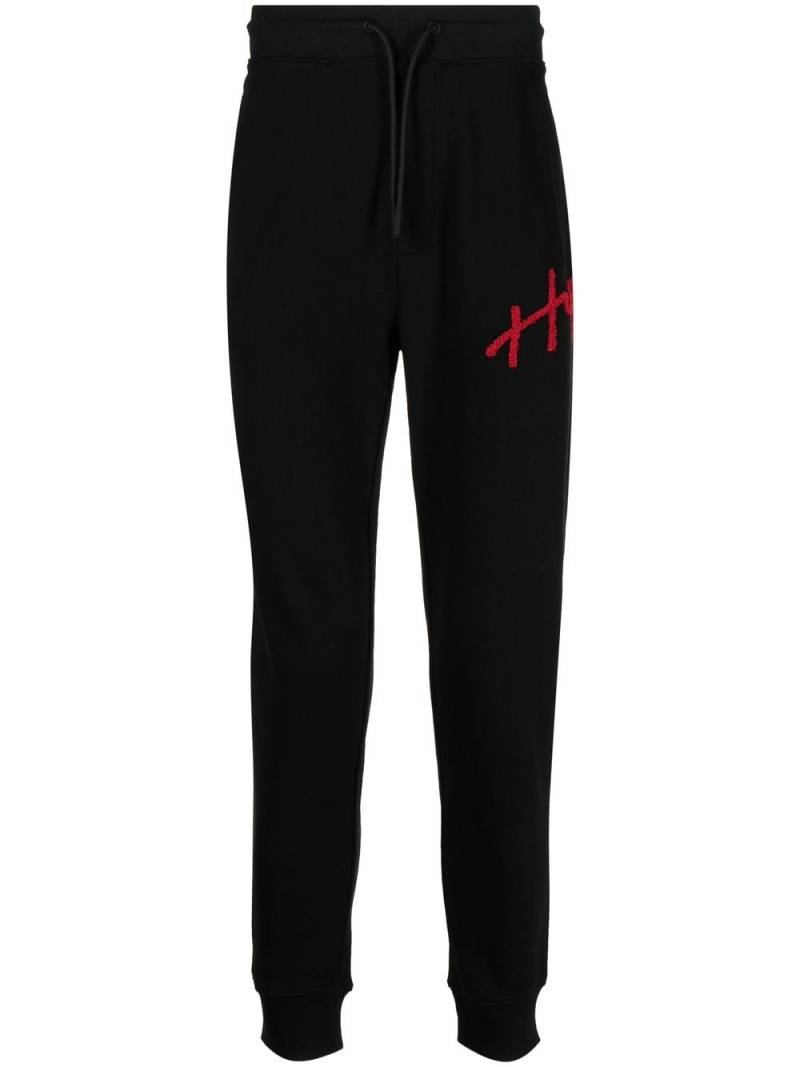 HUGO logo-appliqué track pants - Black von HUGO