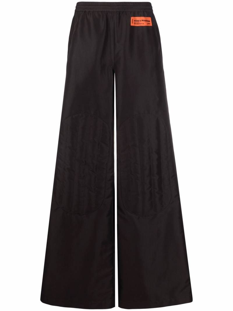 Heron Preston logo-patch wide-leg trousers - Black von Heron Preston