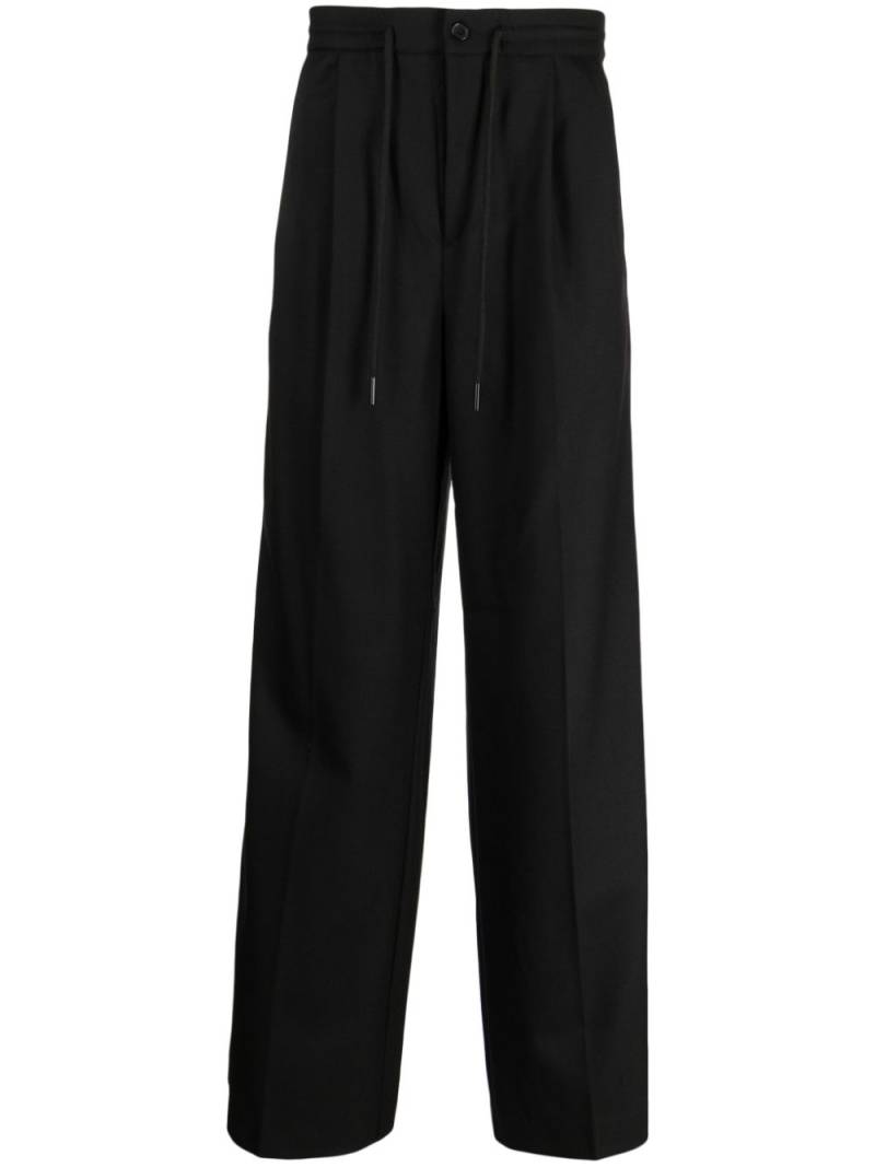 Holzweiler pressed-crease tailored trousers - Black von Holzweiler