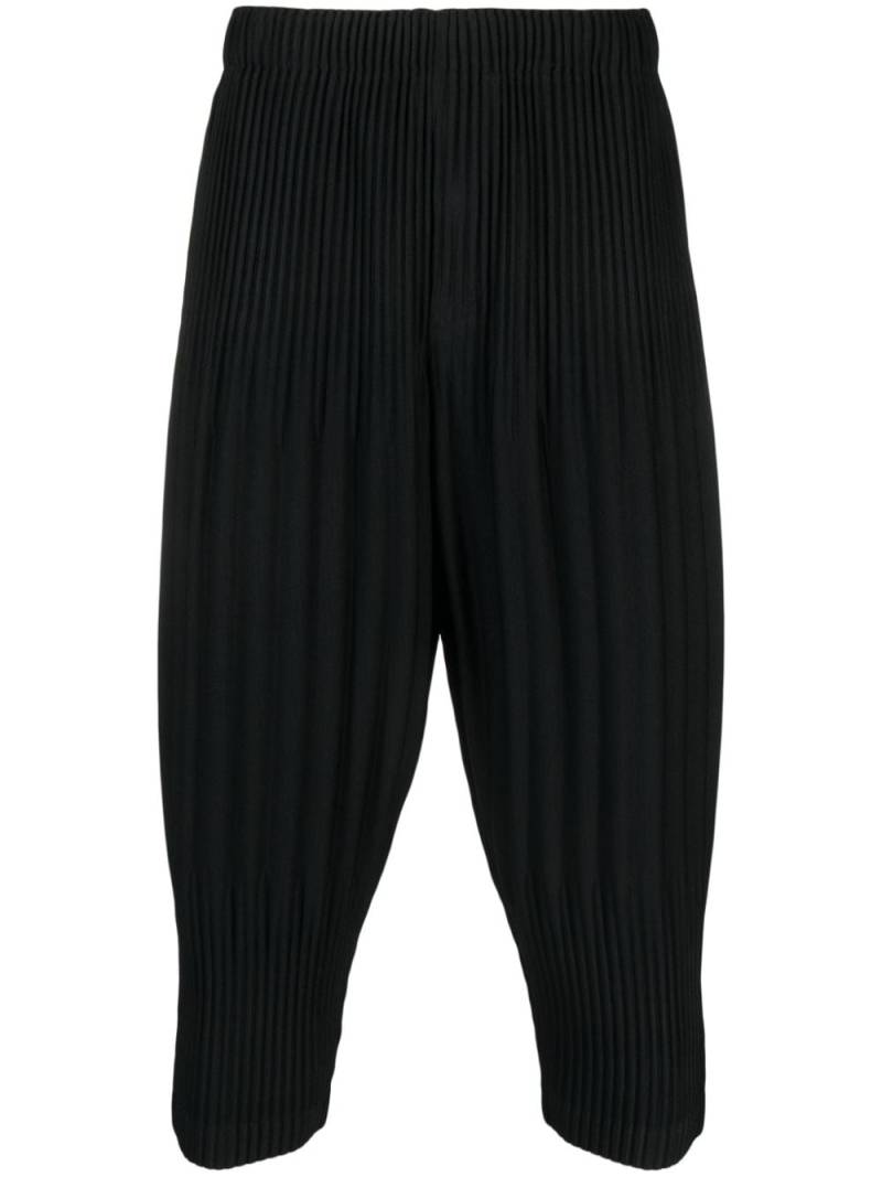 Homme Plissé Issey Miyake pleated tapered cropped trousers - Black von Homme Plissé Issey Miyake