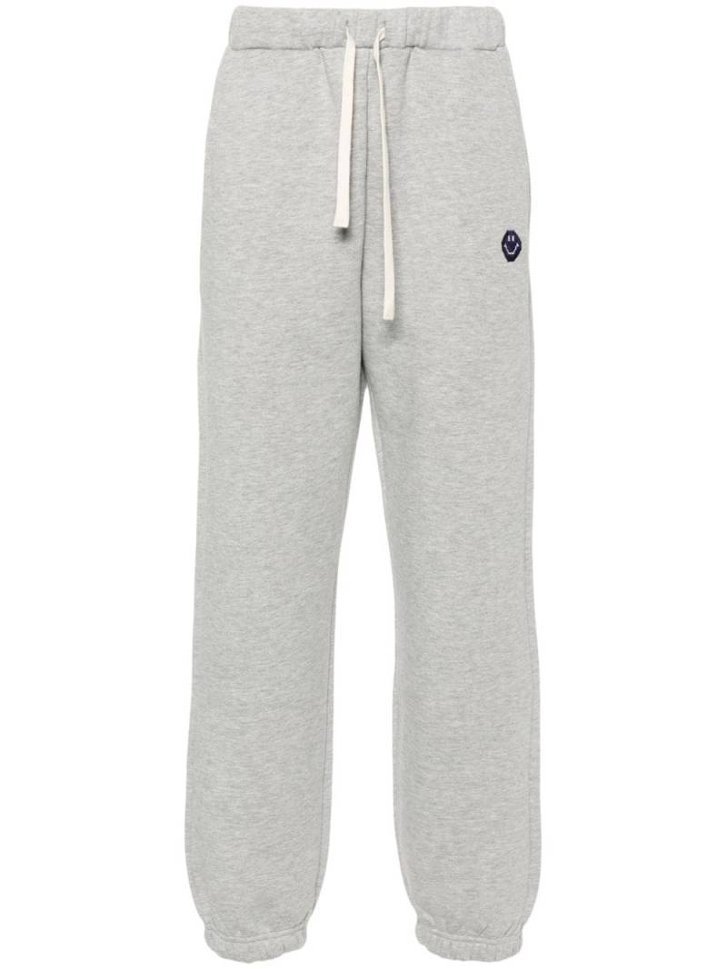 Joshua Sanders smiley face-embroidered track pants - Grey von Joshua Sanders