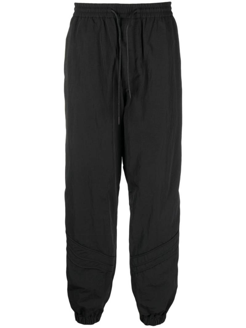 Juun.J tapered-leg drawstring track pants - Black von Juun.J