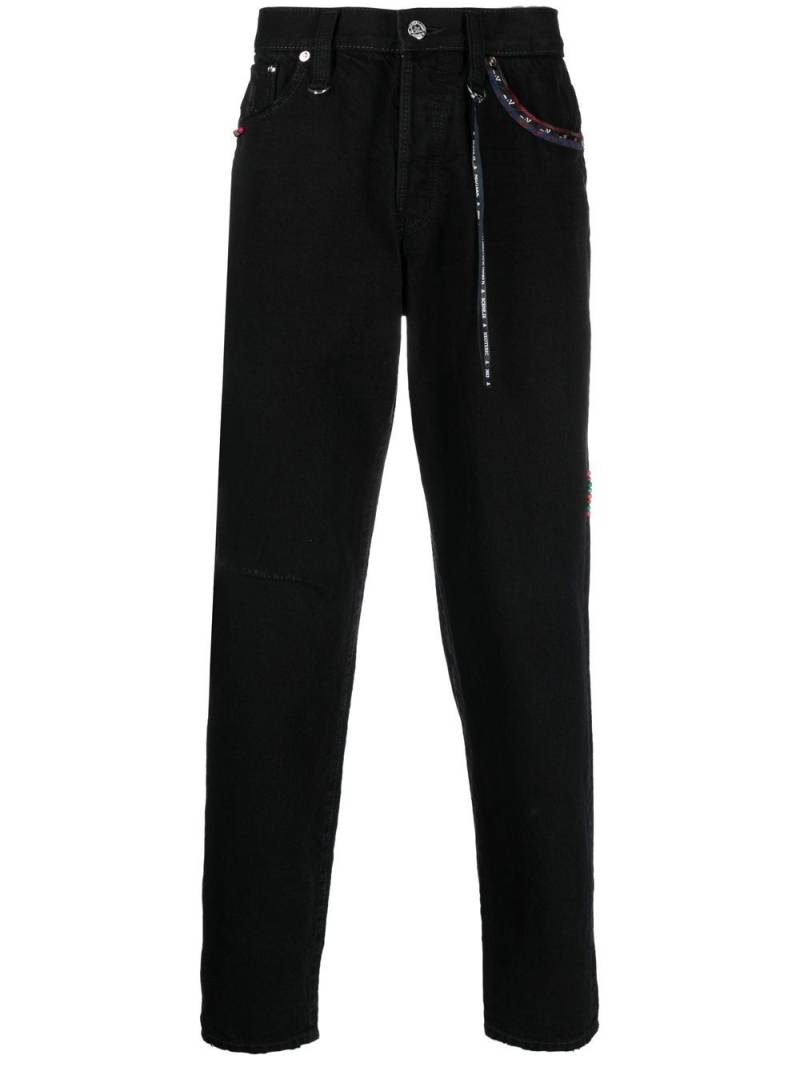 Mastermind World logo-embroidered ankle-zip jeans - Black von Mastermind World