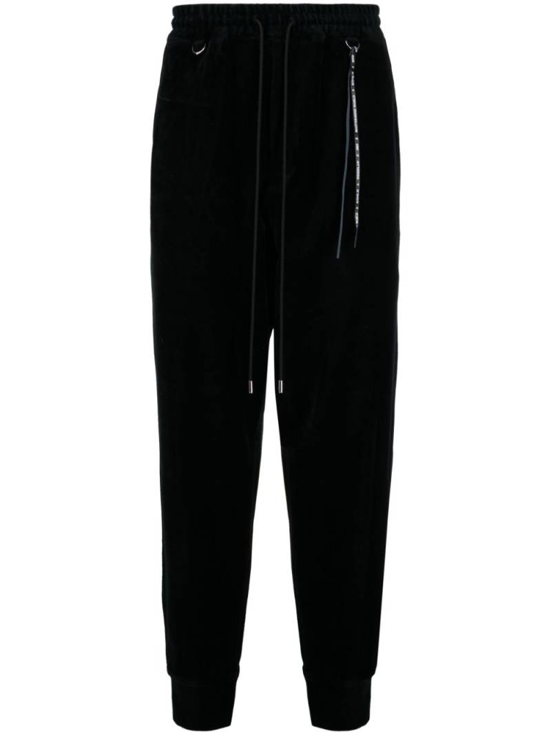 Mastermind World logo-jacquard tapered track pants - Black von Mastermind World