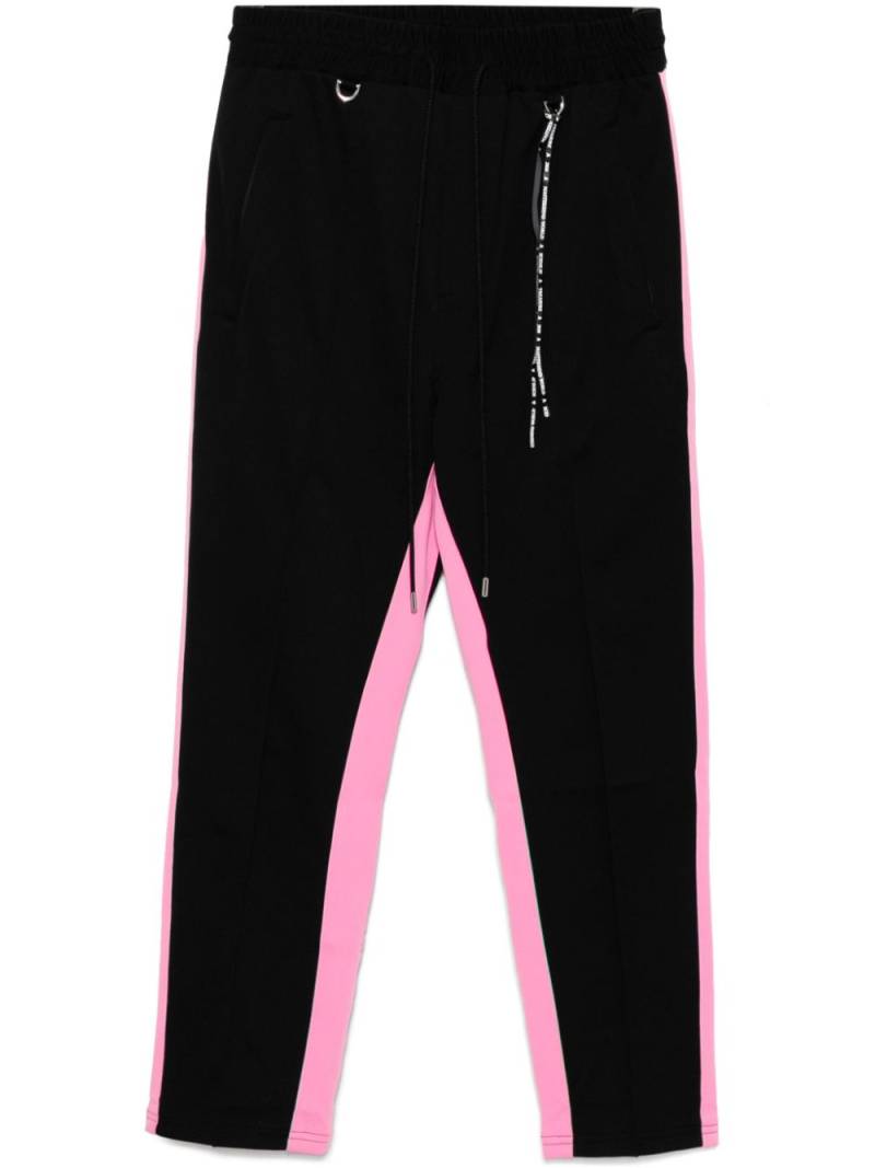 Mastermind World logo-patched track pants - Black von Mastermind World