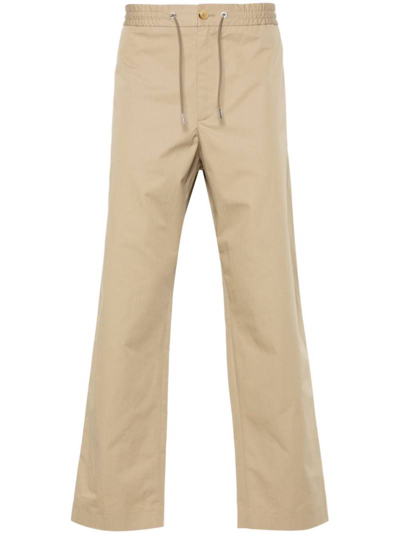 Moncler appliqué-logo cotton tapered trousers - Neutrals von Moncler