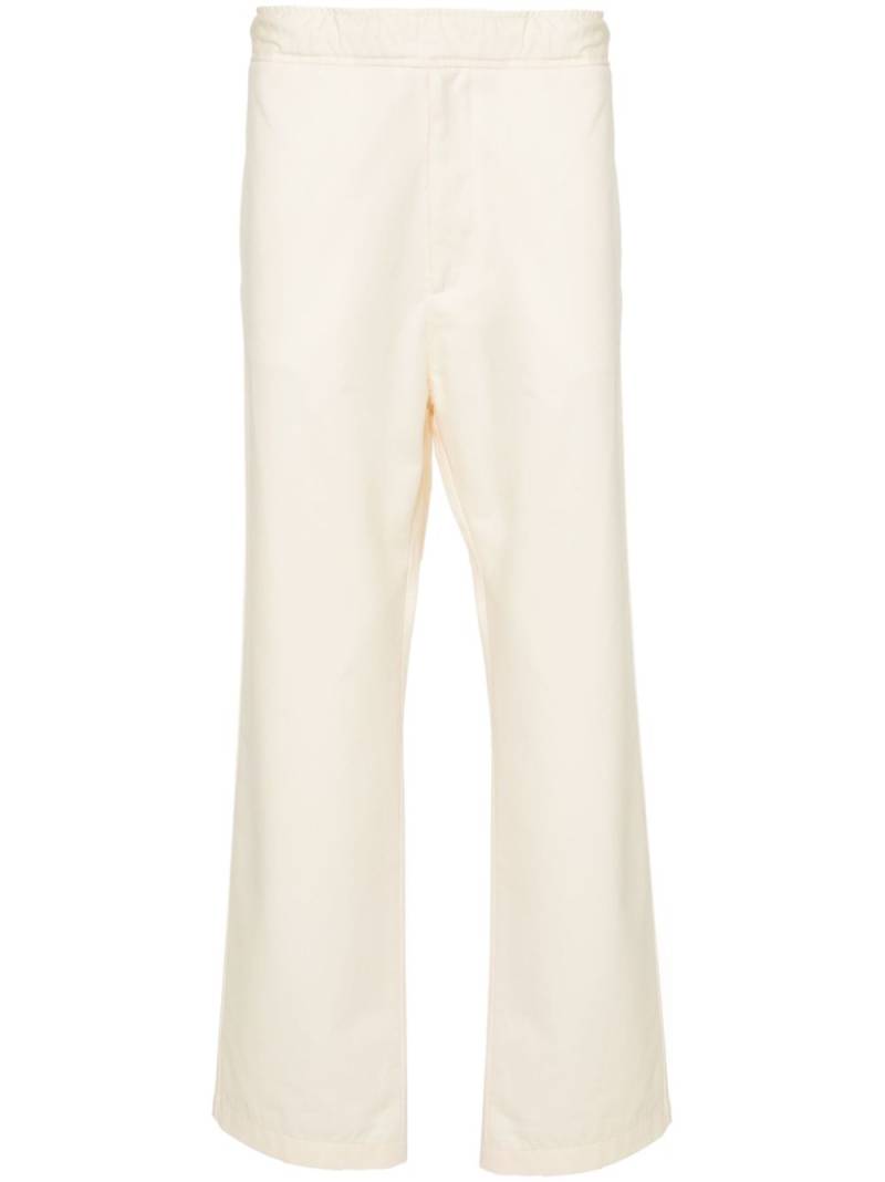 Moncler logo-appliqué straight trousers - Neutrals von Moncler